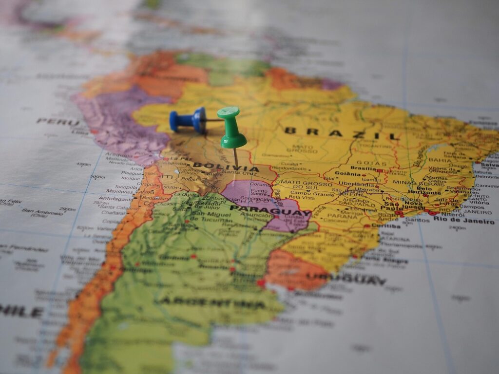 Photograph of a map of South America with two pushpins on it. Image by beasternchen on Pixabay. (English)